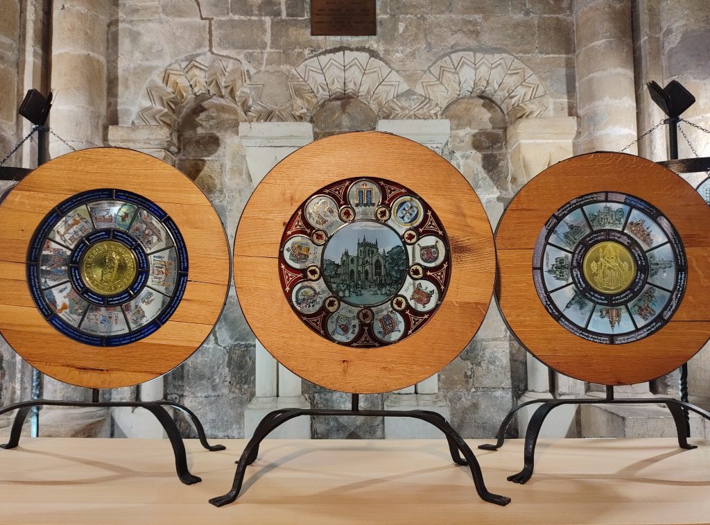 Triptych panels portraying the Abbeys 750 year history